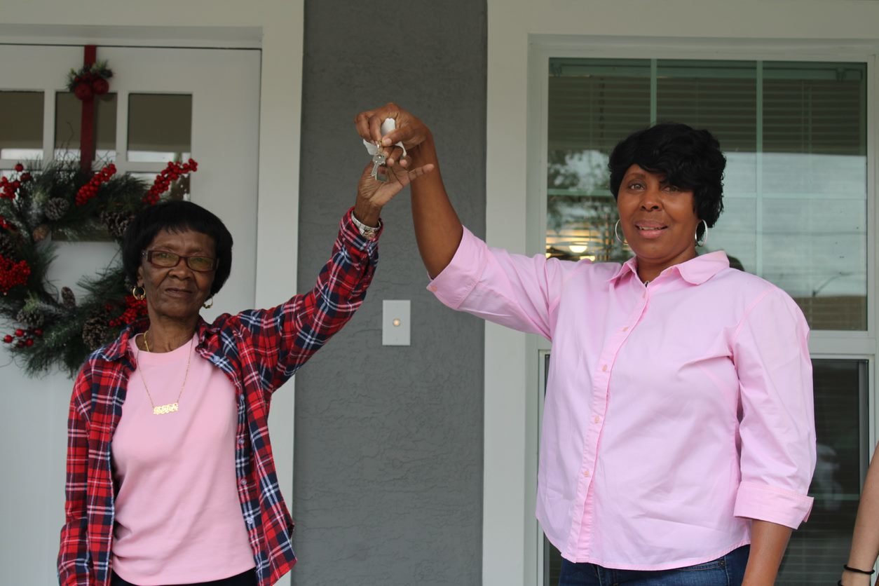 BELLE GLADE -- Consuela Green and her mother, Gearlene Green, hold the keys to their new home.